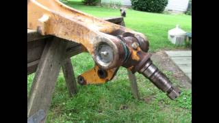 Welding a Cast Iron Front Axle on a 580 E Case Backhoe with 77 Electrode and an Arc Welding Machine [upl. by Ketchum]