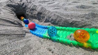 Marble run on the sandy beach ☆ Curving colorful rail amp rain gutter course Dragon Ball [upl. by Caravette]