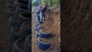 Slope protection building process with tires [upl. by Aetnahc164]