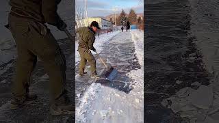 Clearing process of icy road with steel shovel [upl. by Lebasi734]