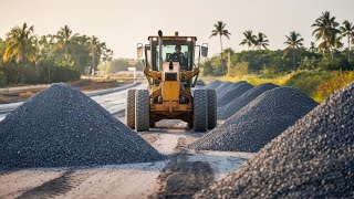 Rural road construction with grader spreading the Piles of gravel along the sides of the dirt road [upl. by Ingeberg]