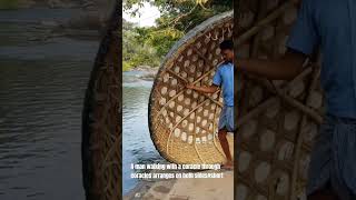 A man walking with a coracle through coracles arranges on both sidesshort [upl. by Anemij]