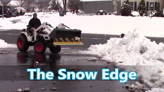 Plow snow with new clamp on Snow Pusher from Ratchet Rake [upl. by Sunday497]