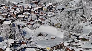 Lauterbrunnen Village Switzerland in Winter  Staubbach Waterfall  Snowcovered village  Drone 4K [upl. by Ativak]