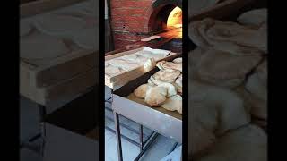 Baking arabic bread kubus in a brick oven in Al Bada KSA Yummy arabic bread for breakfast [upl. by Eltsirc906]