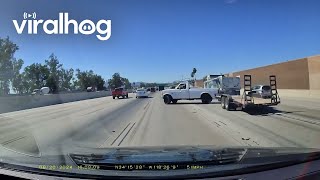 Narrowly Avoiding a Jackknifing Trailer on the Freeway  ViralHog [upl. by Esyla747]