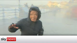 Storm Eunice Sky correspondent gets hit by wave [upl. by Manvil599]