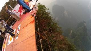 Wingsuit Red Bull eventbase jumps off the dragon wall and Jeb flies through the hole [upl. by Celinka]