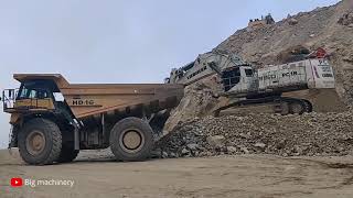 Huge Liebherr R 9150 Mining Excavator Loading Liebherr Haul Truck [upl. by Anilef]