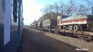 TRUCKS OVER TRAIN  Dadar Madgaon Jan Shatabdi Express overtakes RORO Freight Train at Karanjadi [upl. by Nemsaj]