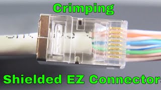 Shielded ezrj45 cat6 connectors being crimped [upl. by Gentille]