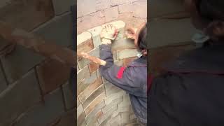 Masonry process of white bricks on the well wall [upl. by Moira]