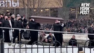 Alexei Navalny’s body seen in coffin as thousands defy Putin to honor opposition leader [upl. by Damiano877]