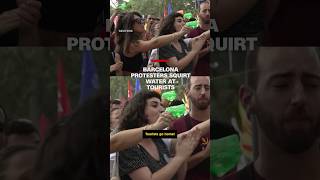 Barcelona protesters squirt water at tourists [upl. by Anicart]