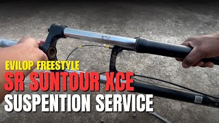 How to service sr suntour XCE fork [upl. by Anrapa912]