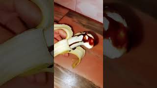 Banana with chocolate syrup trending food  unique shorts [upl. by Aryajay27]