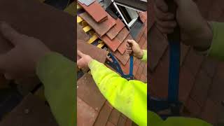 Using the cropper to cut clay tile subscribe roof construction roofer [upl. by Refinney]