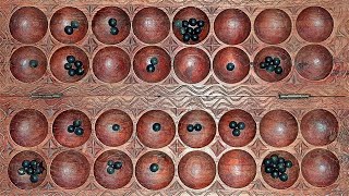 How to play omwesoigisoro African mancala game [upl. by Adnuahsar]