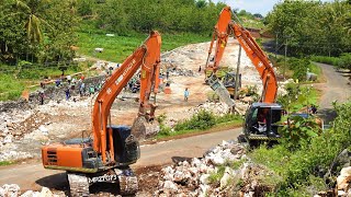 Hitachi Zaxis 200 Excavator Loading Limestone On The Road Construction With Dump Trucks [upl. by Mylor847]