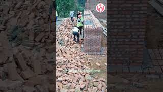 Bricklayers are building a red brick wall [upl. by Junji313]