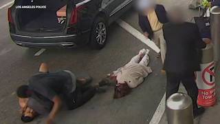 Woman knocked unconscious at LAX during roadrage fight between 2 men [upl. by Daly]