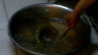 Woman tosses live Snake into boiling water [upl. by Norud]