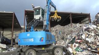 Terex Fuchs MHL 320 handler loading waste into a Doppstadt DW 3060 Bio Power [upl. by Athalie787]