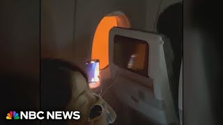 Video shows passengers stuck on burning plane in Japan [upl. by Lurette]