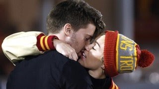 Miley Cyrus and Patrick Schwarzenegger Spotted Kissing amp Smooching at a USC football game [upl. by Gerdeen]