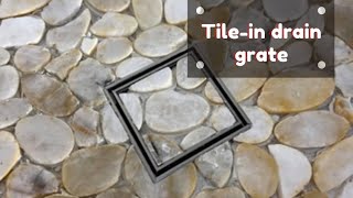 How to tile a tileable  tile in schluter grate with pebble tiles [upl. by Azilanna]