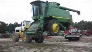 Unloading A 125 Ton 9610 John Deere Combine with Hough 560 [upl. by Iroc]