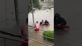 Watch Dramatic moment a flooded street sweeps away a car Shorts [upl. by Leunamme]