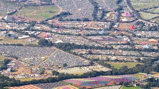 Aerial footage captures sheer scale of Glastonbury Festival 2024  SWNS [upl. by Aipotu529]