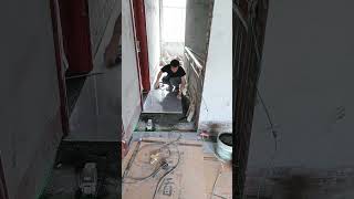 Renovation workers laying stone floor [upl. by Eanaj]