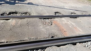 Trains Go Over Railroad Crossing Potholes From Hell [upl. by Sined644]