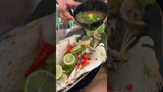 Eating Thai Steamed Fish with Lime and chili and garlic food thaifood [upl. by Nnylrac]