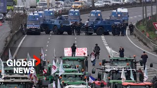 Farmer protests Armoured police vehicles block highway as tractors push to reach Paris [upl. by Jocko]