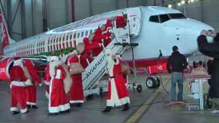 A dozen Santa Claus visiting the Christmas aircraft quotMerry Santaquot of Air Berlin [upl. by Oruntha]