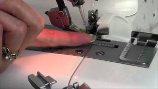 Husqvarna Viking H Class 200S Serger 11 Changing Feet [upl. by O'Callaghan]