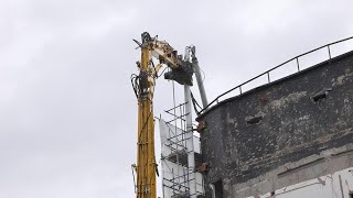 Demolition work in London  The mast is lowered at the Ugly Brown Building Kings Cross [upl. by Suoirrad161]