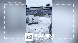 Snow shovelers continue to clear out Highmark Stadium in Buffalo [upl. by Padgett658]